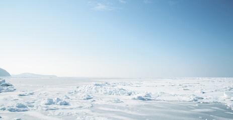 Fototapeta na wymiar Winter landscape - frozen sea surface with snow.