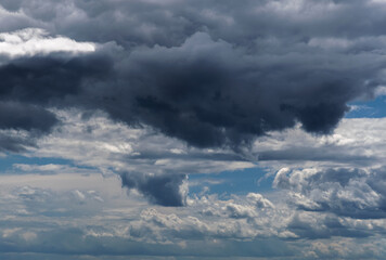 Dramatic sky with white clouds.