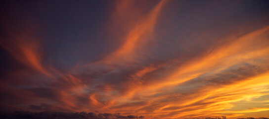 Sunset sky with orange clouds. Nature background. - Powered by Adobe