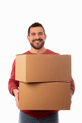 Bearded man on white background holding large cardboard boxes. Delivery of packages. Home improvements. Organization of personal belongings