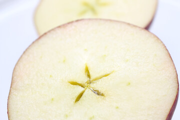 slice of apple. half of apple. inner part of the apple. apple with selective focus.