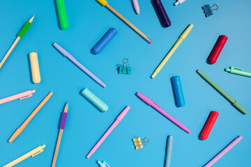 Bright stationery and school supplies on a blue background. Back to school.