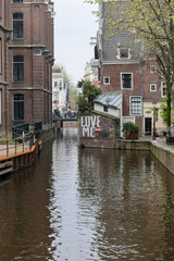 Fototapeta na wymiar De Wallen - called the red light district. It is famous for its entertainment character: brothels, coffee shops, pubs and restaurants located along the canals