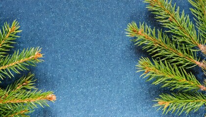 few fir branches on blue sparkling background close up view