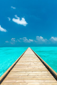 Wooden Jetty out to tropical Sea, The Maldives