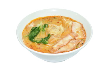 Chinese dumpling topping boiled red barbecue pork with cabbage in tom yum soup on bowl