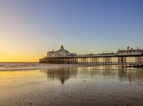 Eastbourne Pier at sunrise, constructed in the 1870s and a Grade II* listed structure, Eastbourne, East Sussex, England