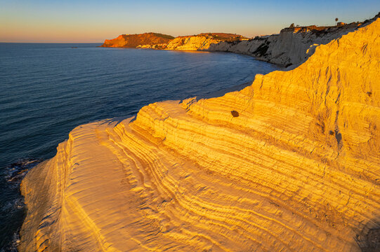Aerial shot of Scala dei Turchi staircase seen from a drone at sunrise, Realmonte, Agrigento province, Sicily, Mediterranean