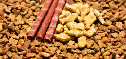 Treats for cats meat sticks sausages and catnip cookies.