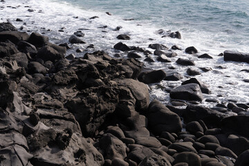waves on the rocky beach in southern Jeju Island