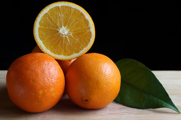navel oranges on dark background