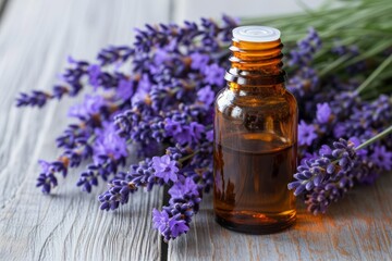 Fototapeta na wymiar Bottle of Lavender essential oil with fresh lavender flowers on wooden table