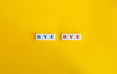 Bye Bye Text on Block Letter Tiles on Yellow Orange Background.