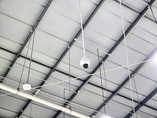 Hanging Internal CCTV Camera on the Ceiling of Warehouse.