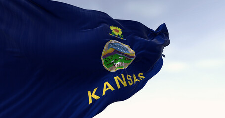 Close-up of Kansas state flag waving in the wind on a clear day