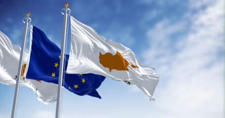 Cyprus national flag waving with the European Union flag on a clear day