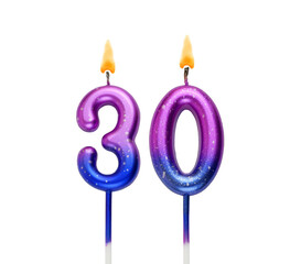 Burning birthday cake candles isolated on white background. Number 30.	