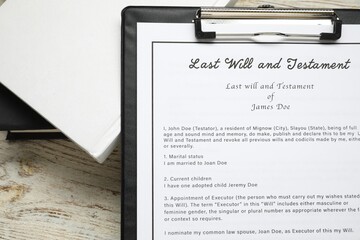 Last Will and Testament with books on white wooden table, top view