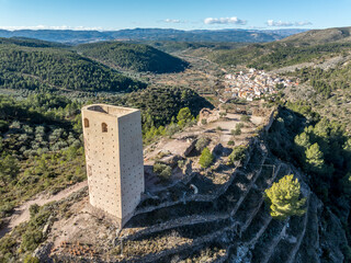 Aerial view of Almonecir Castle,  in the Sierra de Espadán above Vall de Almonacid, irrigated...