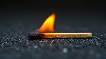 burning match on black