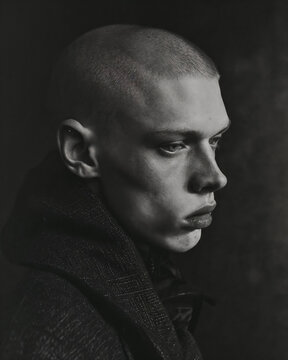 Contemplative young man in monochrome profile. Generative AI image