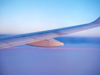 Closeup of airplane wing flying