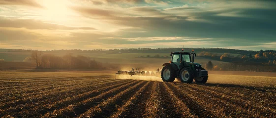 Fotobehang Dawn breaks over a modern tractor tilling the field, promising a bountiful harvest through advanced agriculture © Ai Studio