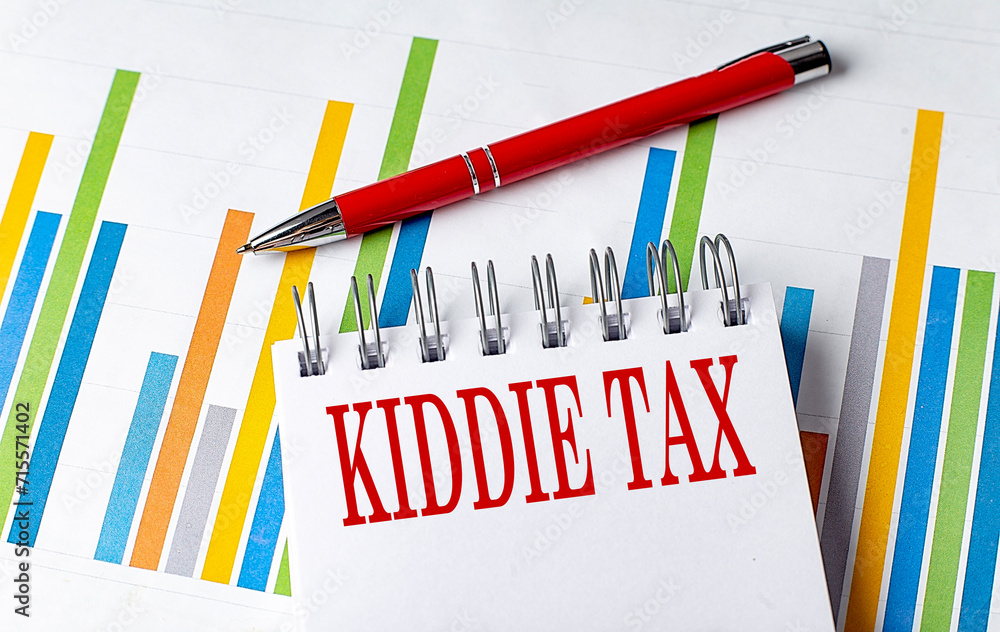 Poster kiddie tax text on a notebook with chart and pen business concept