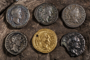 A treasure of Roman gold and silver coins.Trajan Decius. AD 249-251. AV Aureus.Ancient coin of the Roman Empire.Authentic silver denarius, antoninianus,aureus of ancient Rome.Antikvariat.
