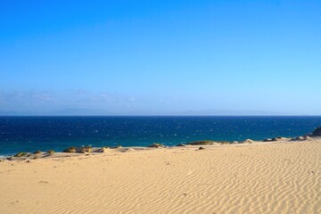 large sand dune of Valdevaqueros in Andalusia with a view to the Atlantic Ocean, Morocco at the...