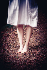 girl's feet barefoot in nature