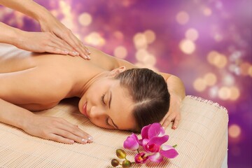 Obraz na płótnie Canvas Woman enjoying body massage at spa salon.