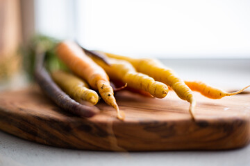 close up of carrot tips on a chopping board