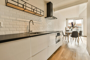 Modern kitchen and dining area with natural light