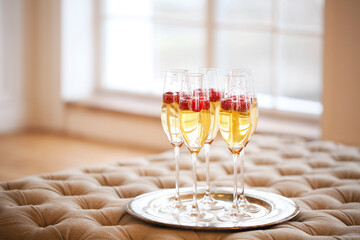 Champagne glasses on silver tray. Party concept