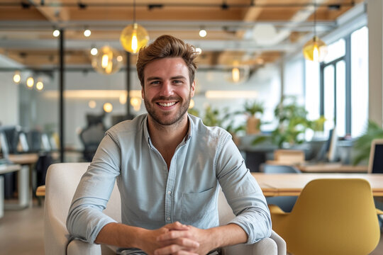 Portrait of a young business man smiling and looking at camera