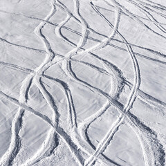 Snowy off-piste ski slope with trace from skis - 715612600