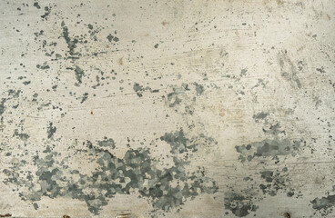 Old scraped metal sheet of galvanized steel with worn out acrylic paint, grunge texture