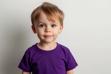 Naklejka premium Little Boy In Purple Tshirt On White Background, Mockup