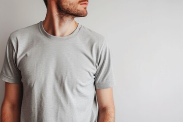 Fototapeta premium Mockup Of A Male Model Wearing A Light Gray T-Shirt On A White Background