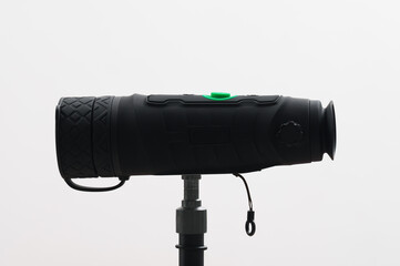Monocular on a tripod isolated on a white field.