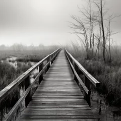 Foto op Plexiglas Wooden walkway in a marsh, black and white image. © Ula