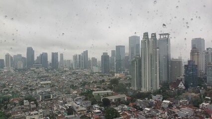 Jakarta, Indonesia – January 19, 2024: A rainy cityscape view of Indonesia capital city Jakarta