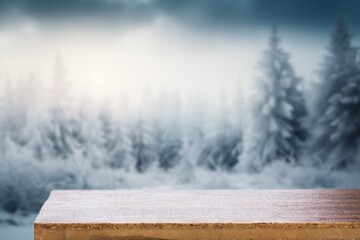 The empty wooden table top with background of winter forest
