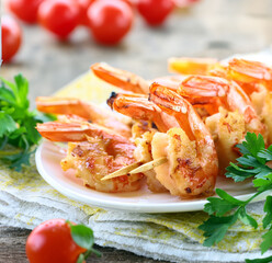 appetizer shrimp fried on skewers on a plate