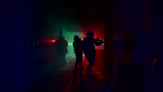 SWAT team or counterterrorist tactical unit in dark corridor, danger profession for men