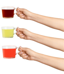 Women's hands hold. Three cups of green, black and red tea tea in a transparent glass cup. On a...