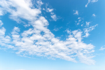 Naklejka na ściany i meble Blue sky background with white clouds. Nature background.