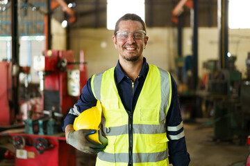 Senior caucasian white ethnicity factory foreman in factory portrait, man in safety suit looking and smiling to camera. - obrazy, fototapety, plakaty