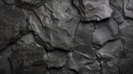 Close-up of a dark slate texture with natural patterns.